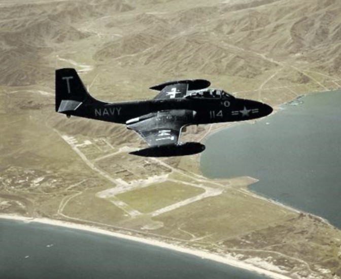 A McDonnell F2H-2 Banshee, Bu. No. 125663, of VF-11 ("Red Rippers"), over Wanson Harbor, Korea, 20 October 1952. (U.S. Navy80-G-480436) 
