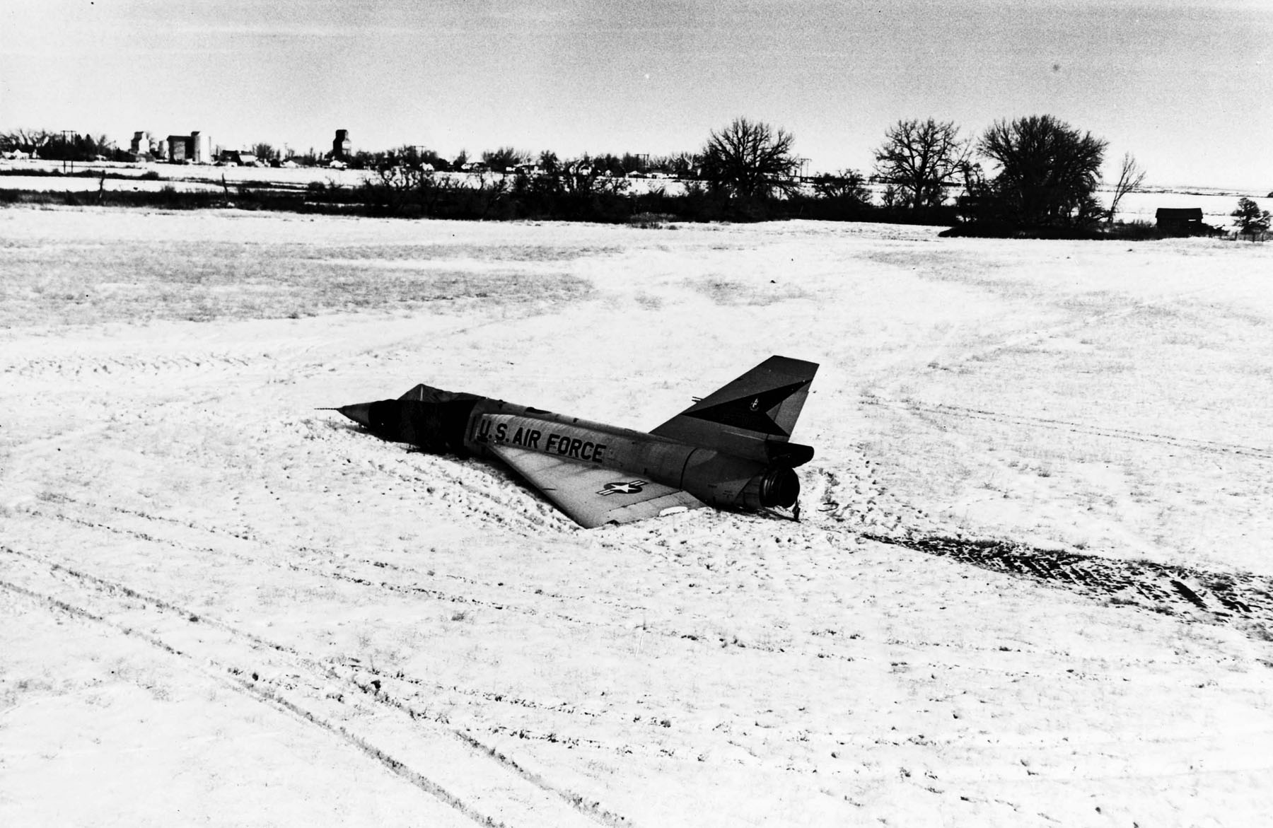 This F-106A (S/N 58-0787) was involved in an unusual incident. During a training mission, it entered an flat spin forcing the pilot to eject. Unpiloted, the aircraft recovered on its own and miraculously made a gentle belly landing in a snow-covered field. (U.S. Air Force photo)