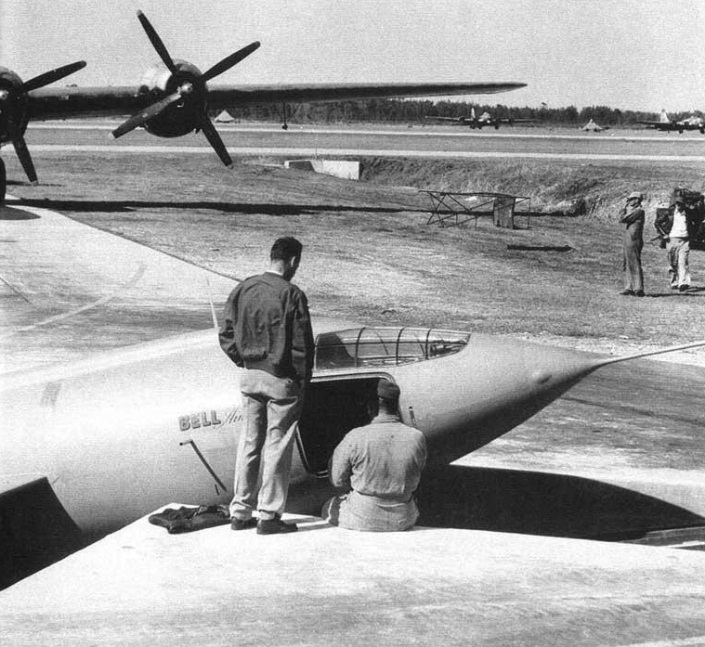 Bell XS-1 46-062 was placed in a pit at Pinecastle A.A.F. so that the B-29 drop ship in the background could be positioned over it. (NASA)