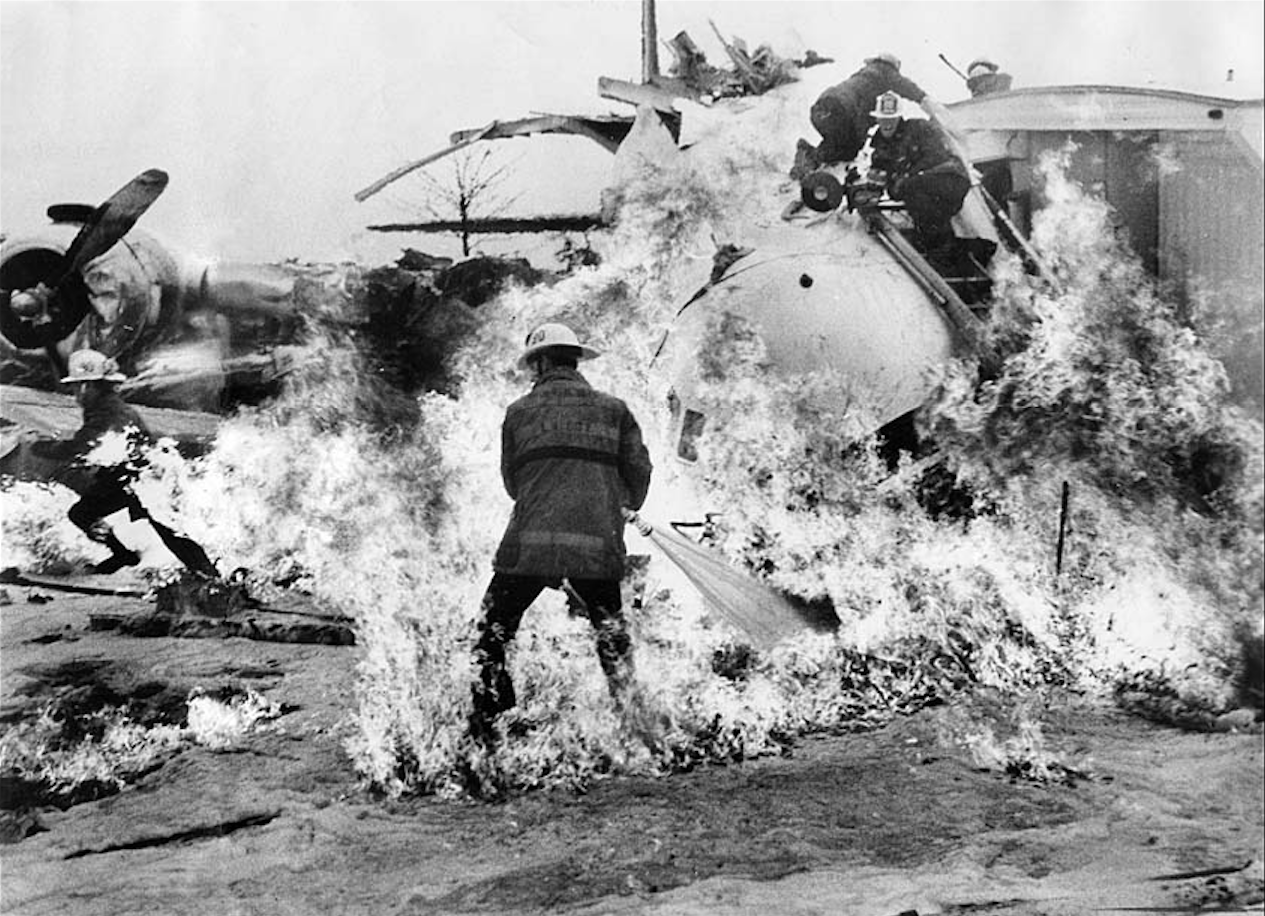 "Feb. 8, 1976: Firemen scatter after saw ignites gas fumes at crash site of DC-6 in Van Nuys. Three trapped crew members of Mercer Enterprises DC-6 charter plane died. Ten firemen were injured." (Boris Yaro/Los Angeles Times)