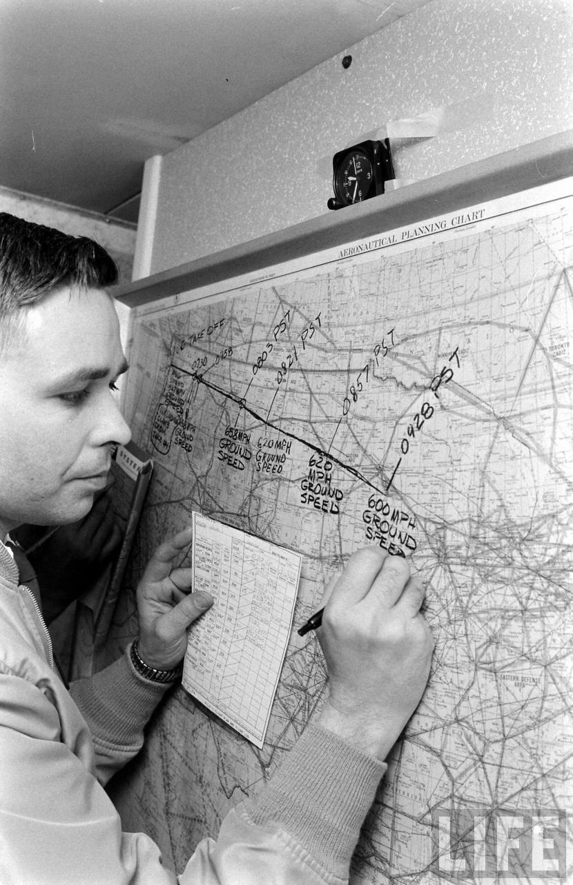 Boeing test pilot S.L. "Lew" Wallick updates the chart with the Dash 80's present position. (Leonard Mccombe/LIFE Magazine)