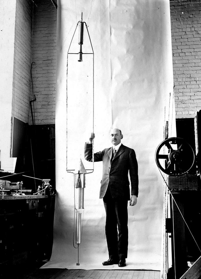 Dr. Robert H. Goddard with "Nell," a liquid-fueled rocket, in hi sworkshop at Clark University. (National Museum of the United States Air Force)