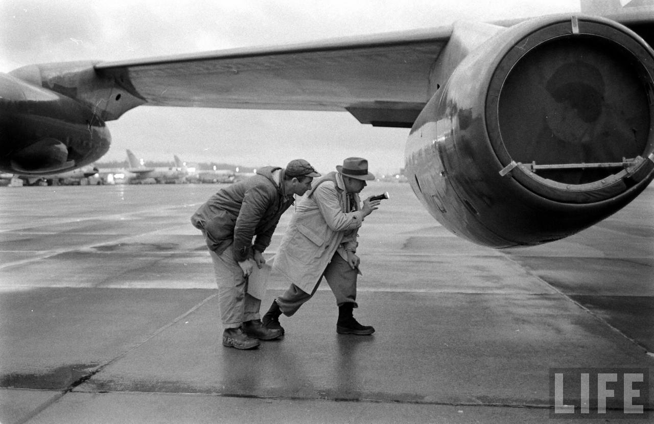 Pre-flight inspection at Boeing Field, Seattle, Washington. In the background are newly-built Boeing B-52 Stratofortress bombers. (Leonard Mccombe/LIFE Magazine)