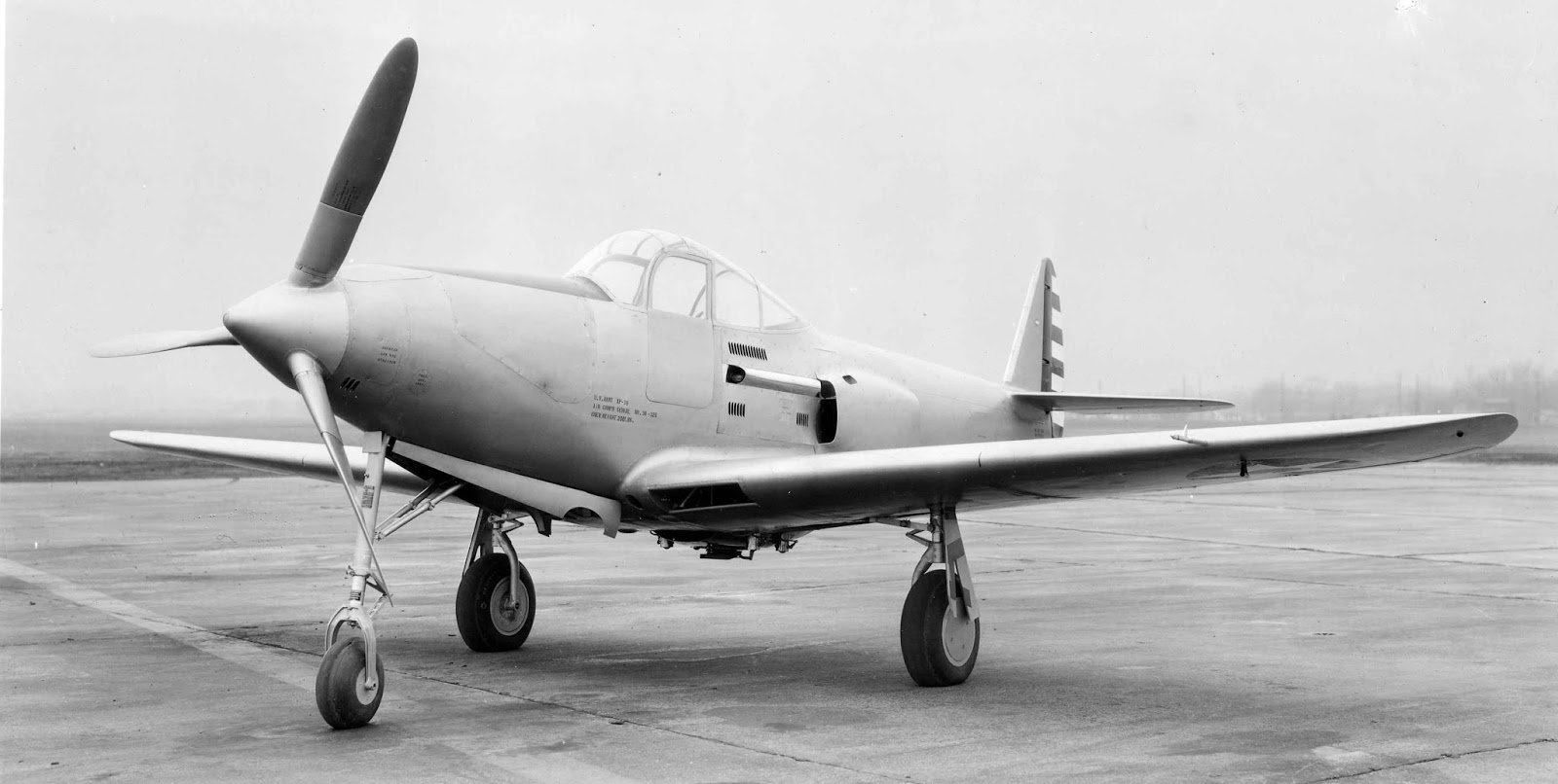 The Bell XP-39 prototype in the original turbosupercharged configuration. The intercooler and waste gates created significant aerodynamic drag. (Bell Aircraft Corporation)