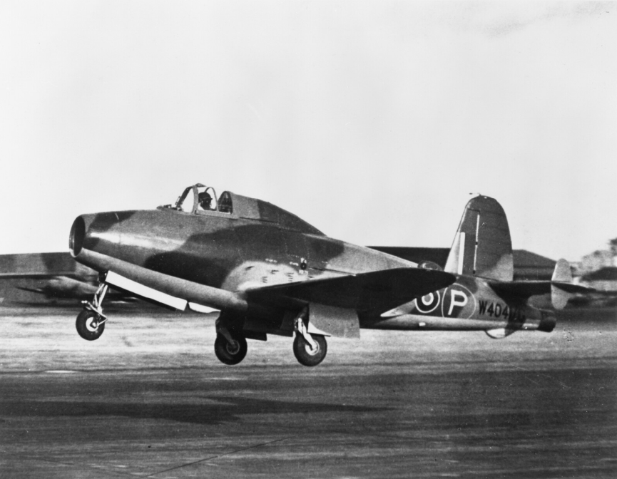 Gloster-Whittle E.28/39, W4041/G, piloted by Squadron Leader J. Moloney, takes off from RAE Farnborough for a test flight. (Flight Lieutenant Stanley Devon, Royal Air Force Official Photographer. © Imperial War Museum CH 14832A)