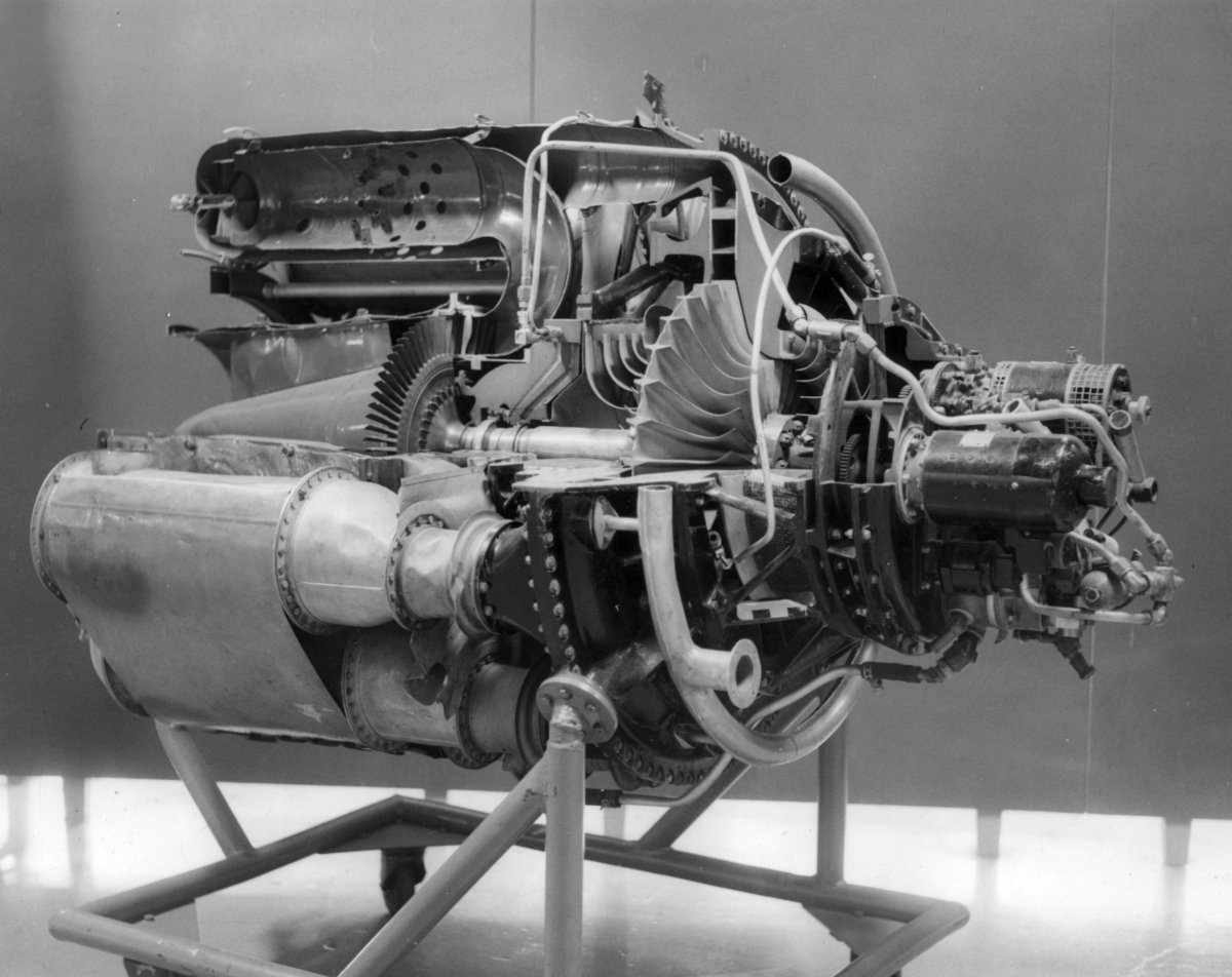 A cutaway display of a General Electric I-A turbojet engine. The compressor and turbine are on a single shaft (center). One of the combustion chambers is sectioned at the upper left. (National Museum of the United States Air Force)