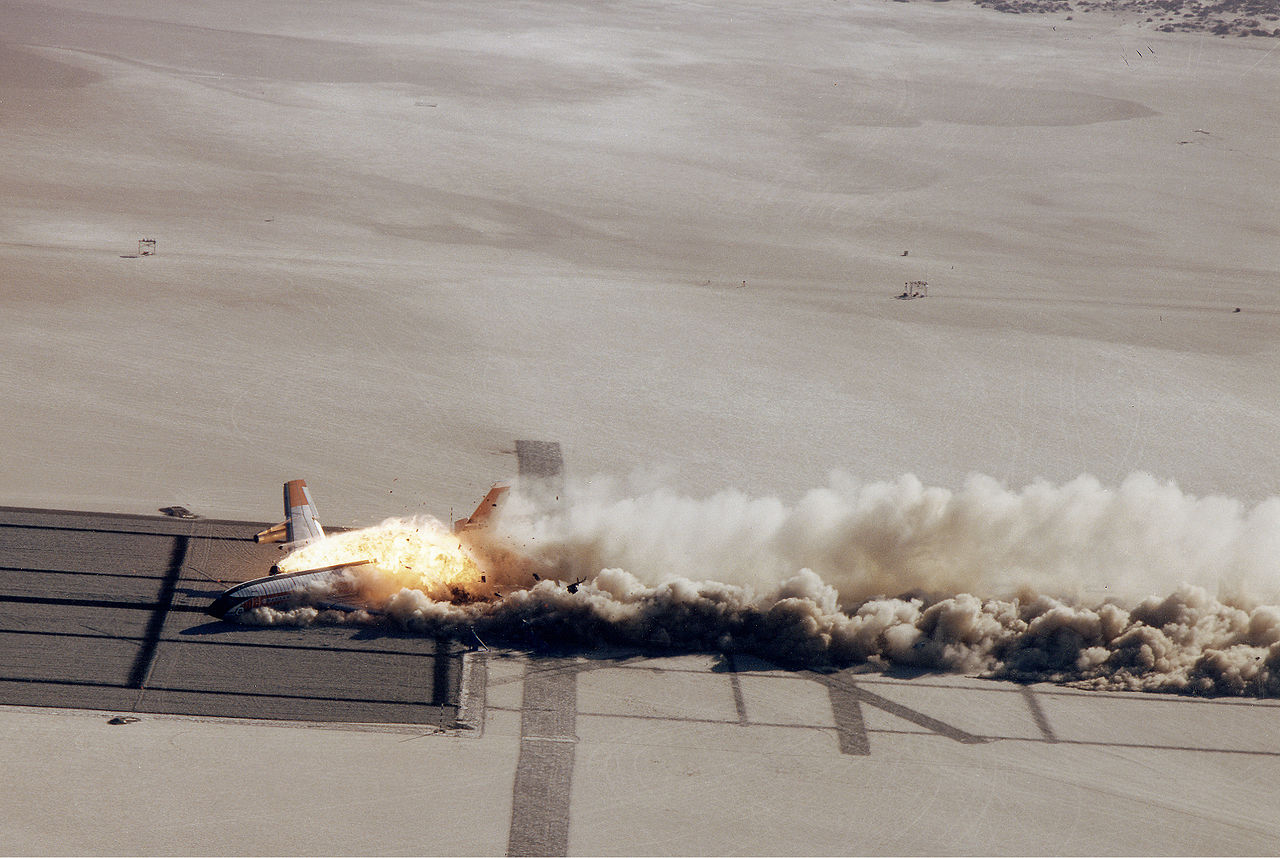  As the airliner slides through the "rhino" barriers, they rip open the fuel tanks, the Number Three engine and the passenger compartment. The raw fuel immediately ignited. (NASA)