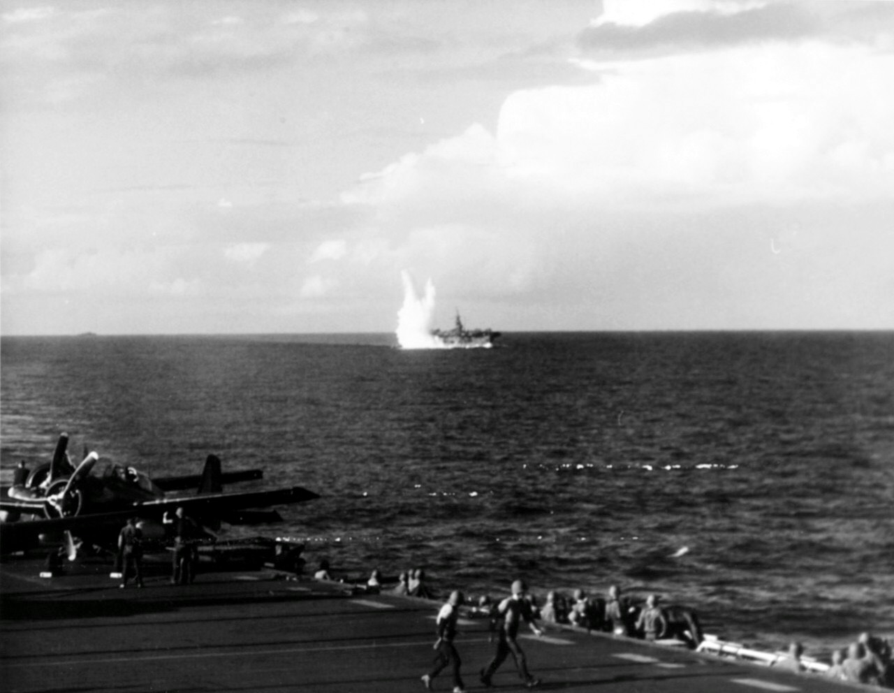 USS Santee (CVE-29) being hit by a torpedo fired from the Japanese submarine I-56, 0757, 25 October 1944. (Naval History and Heritage Command NH 71526)