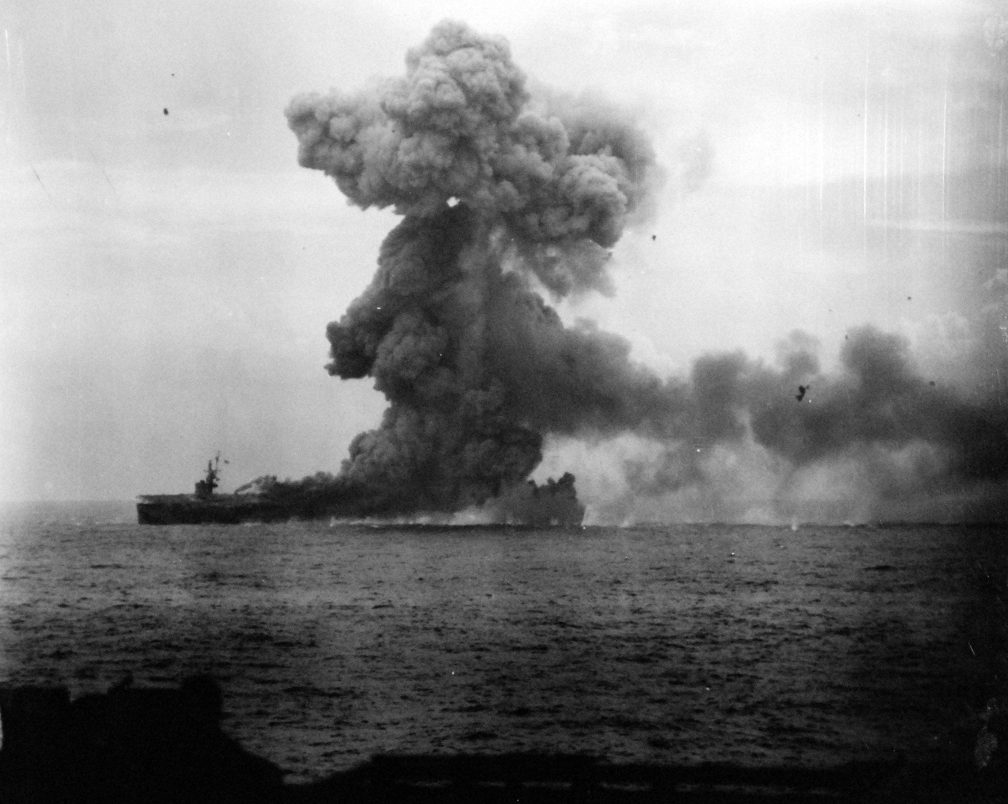 An explosion aboard USS St. Lo (CVE-63), immediately after being hit by a kamikaze, 10:51 a.m., 25 October 1944. Photograph taken from USS Kitkun Bay (CVE-71). (National Archives and Records Administration 80-G-270513)